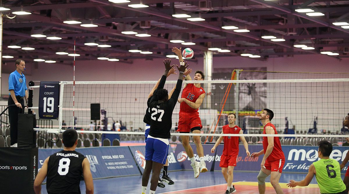 Men playing volleyball